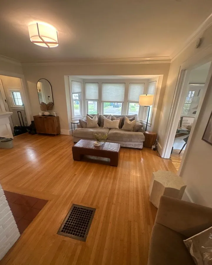 Living room with a bay window and shining hardwood floor